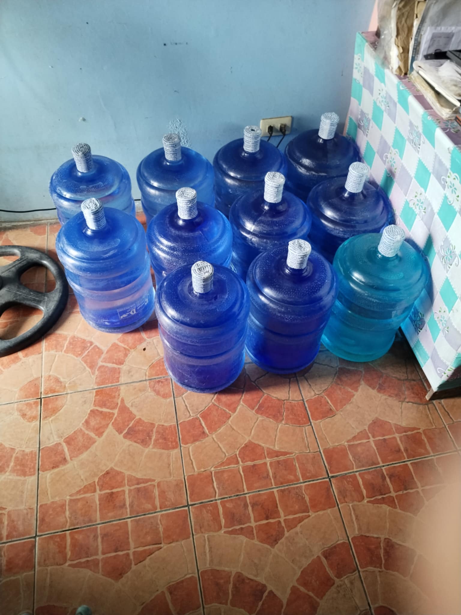 Sealed blue water containers ready for delivery