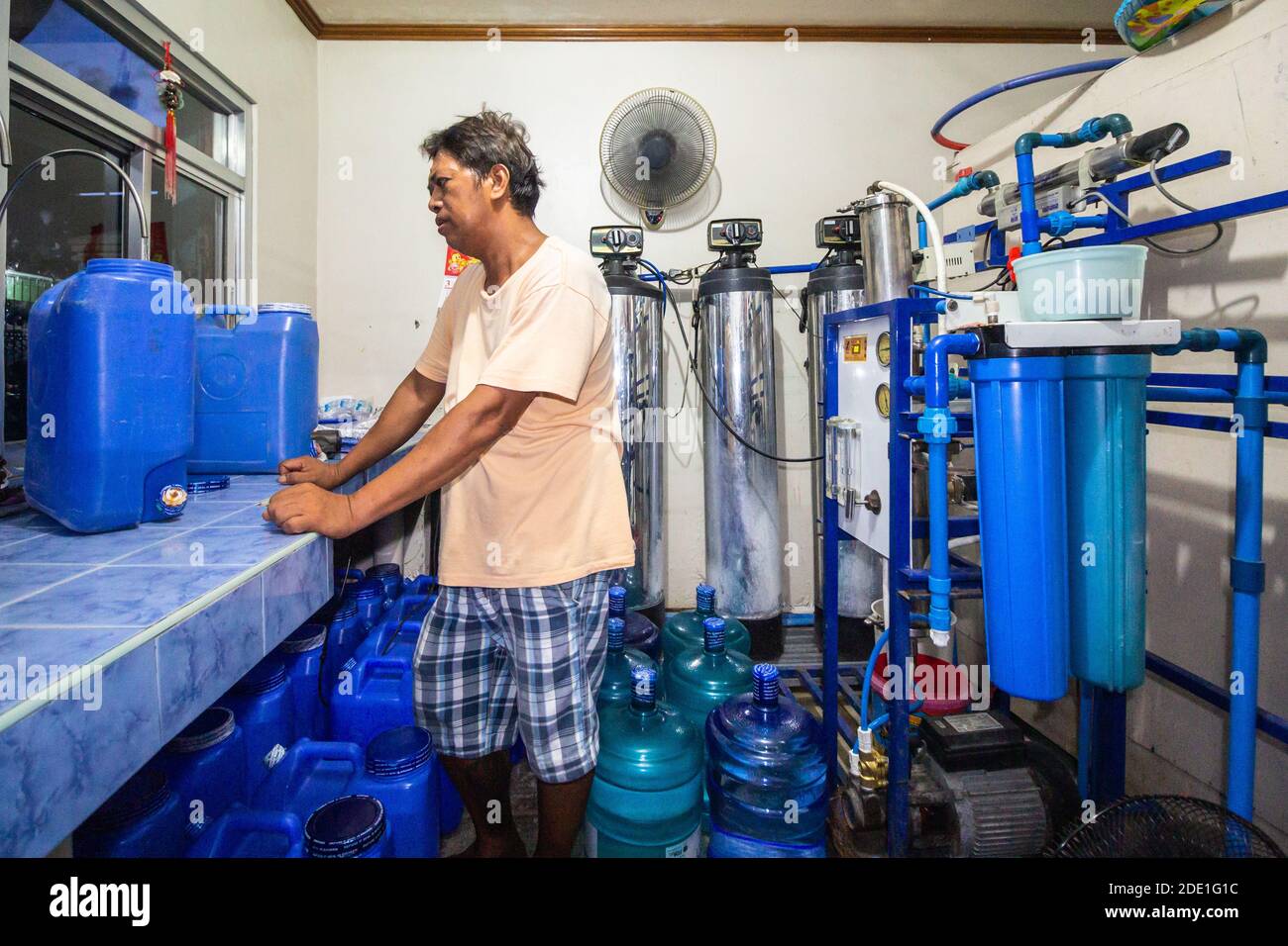 Person refilling water containers